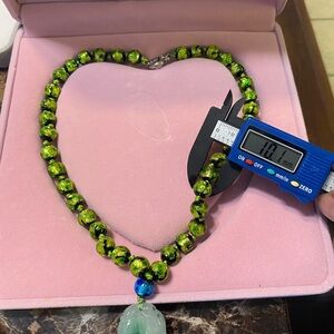 WATCH THE VIDEO. Green Hotaru beaded necklace.